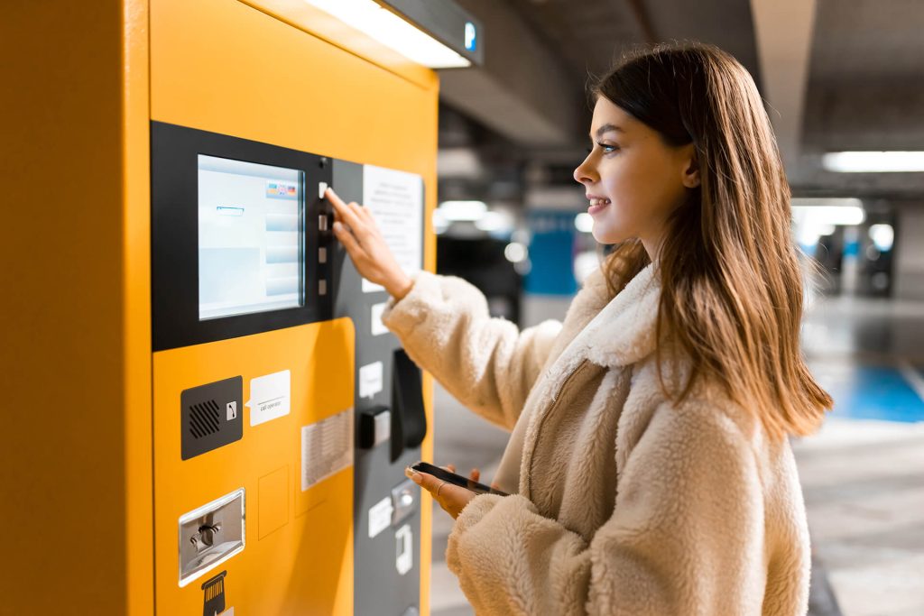 elegant young girl pays for ticket in parking mete 2026 03 10 03 13 33 utc