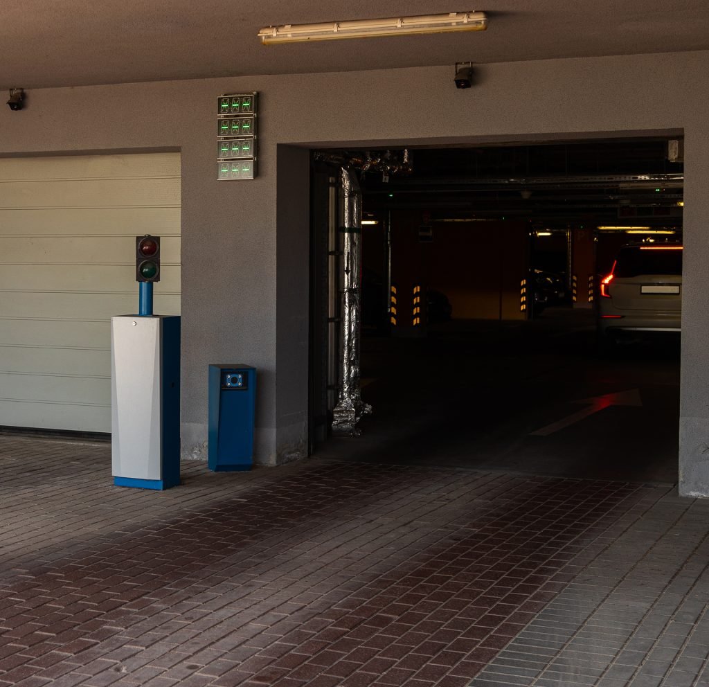 white and red gate arm at modern parking area