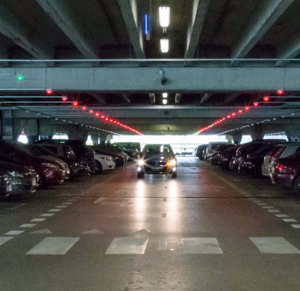 white and red gate arm at modern parking area